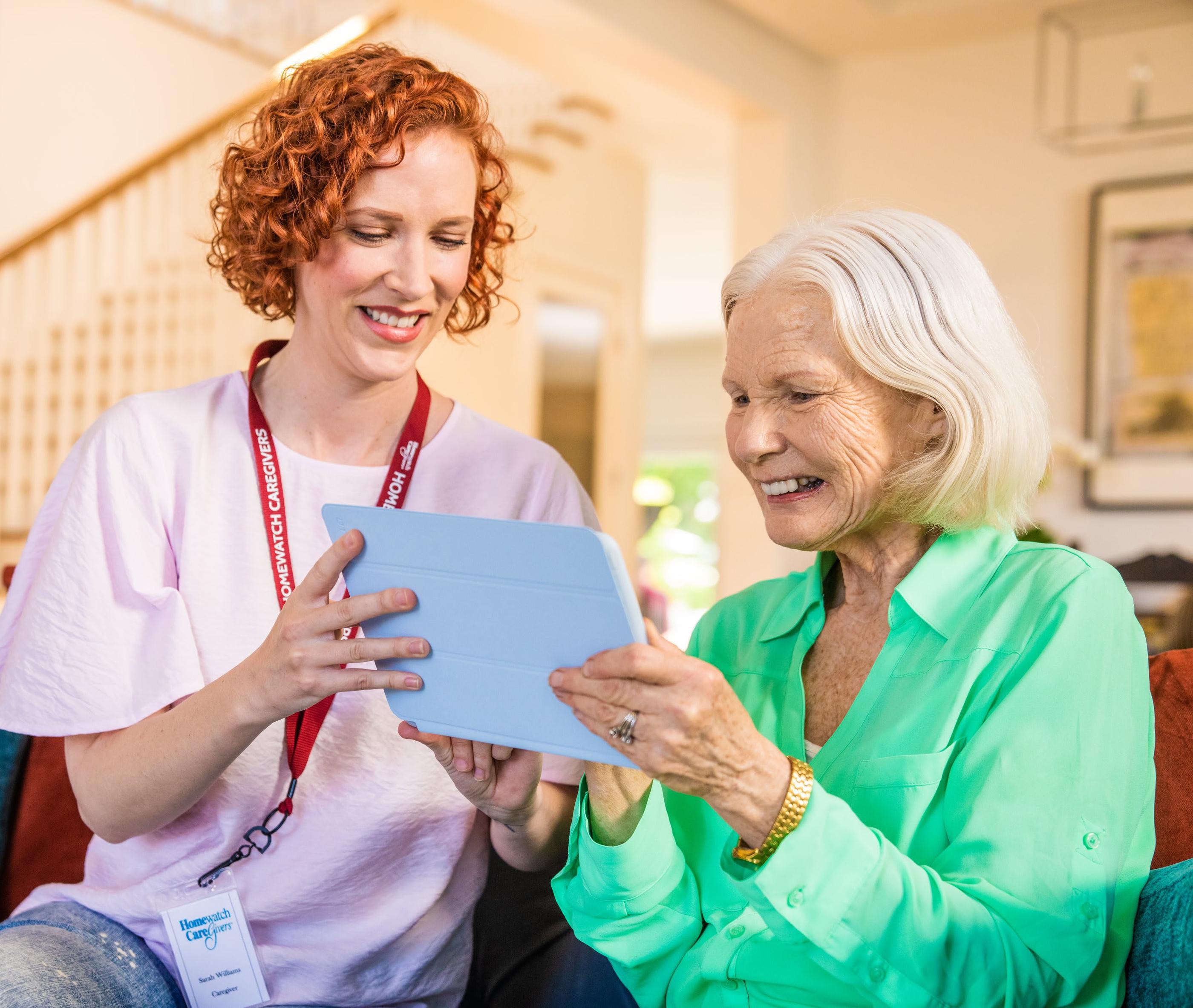 An elderly woman using a tablet