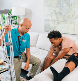 man needing assistance with broken leg