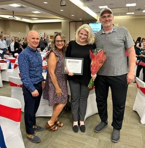 Group of people posing for photo