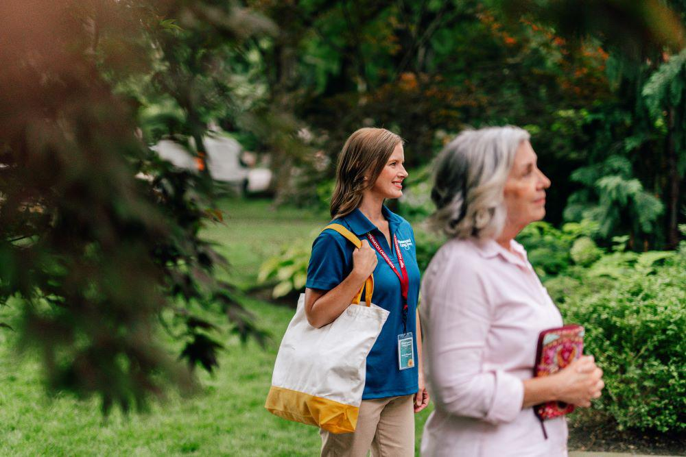 An aide walking with a client