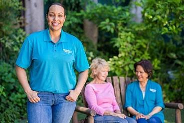 woman standing with her hands in her pockets