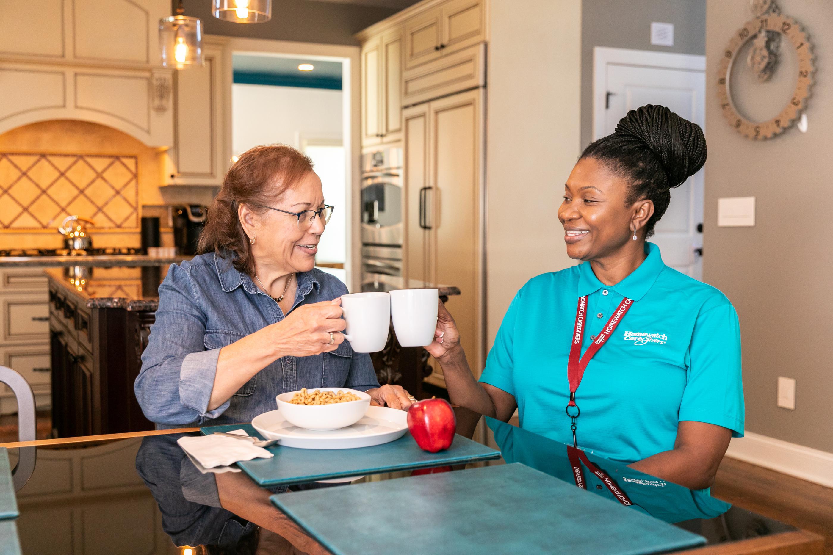 two women clinking glasses