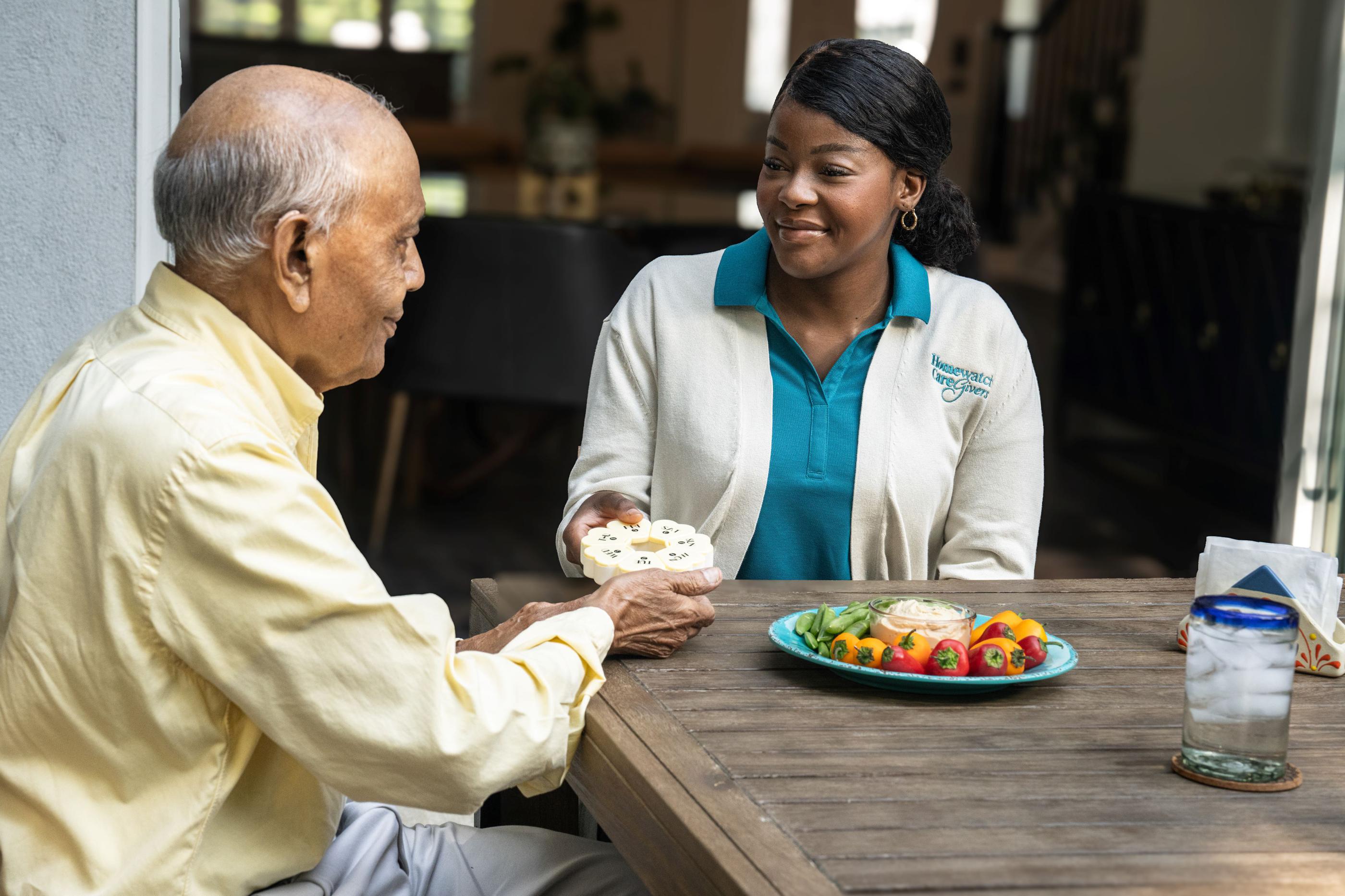 A caregiver talking to a patient
