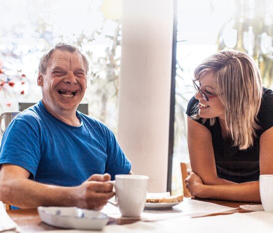 man and woman enjoying coffee together