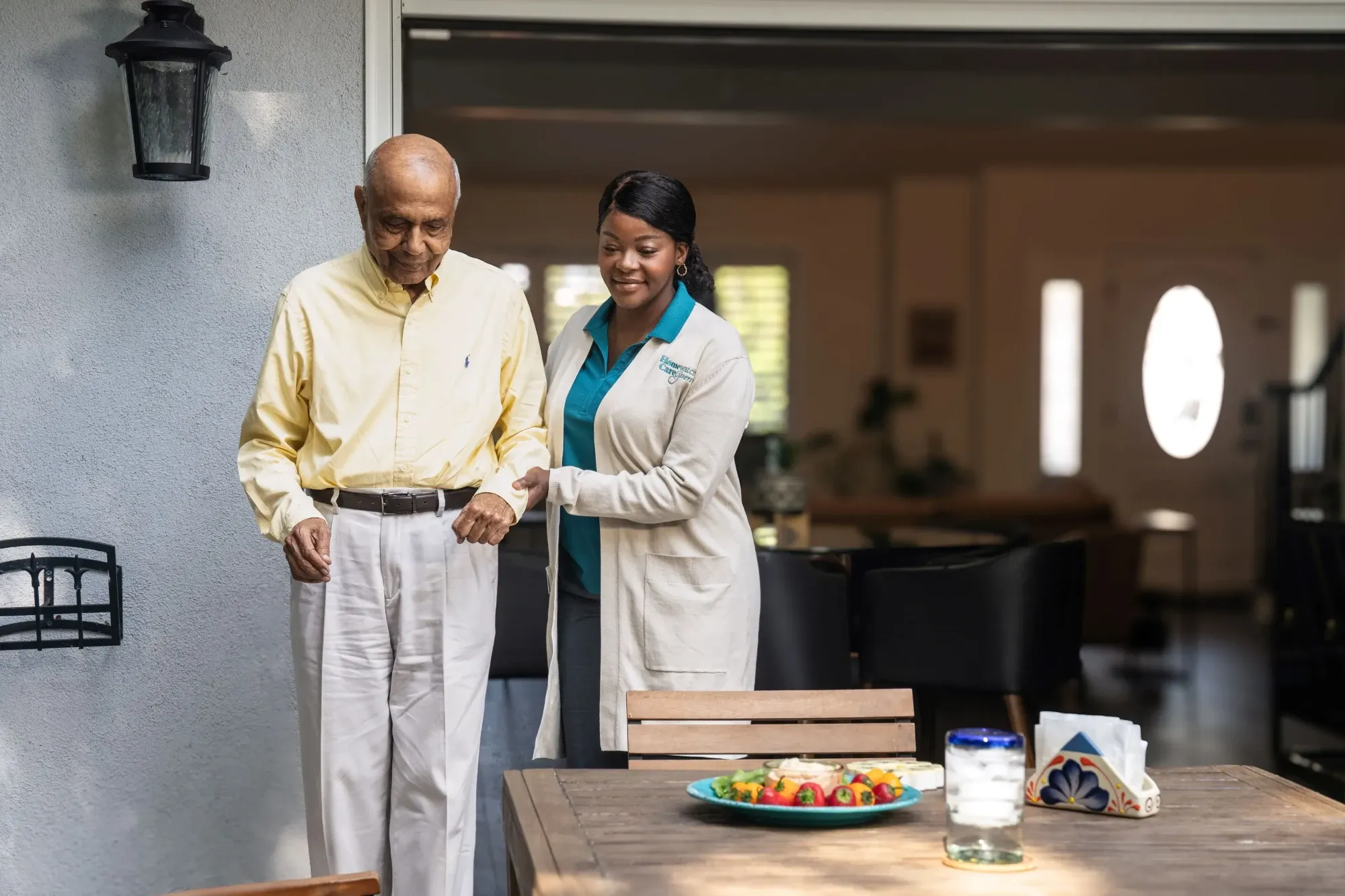 Man and caregiver walking