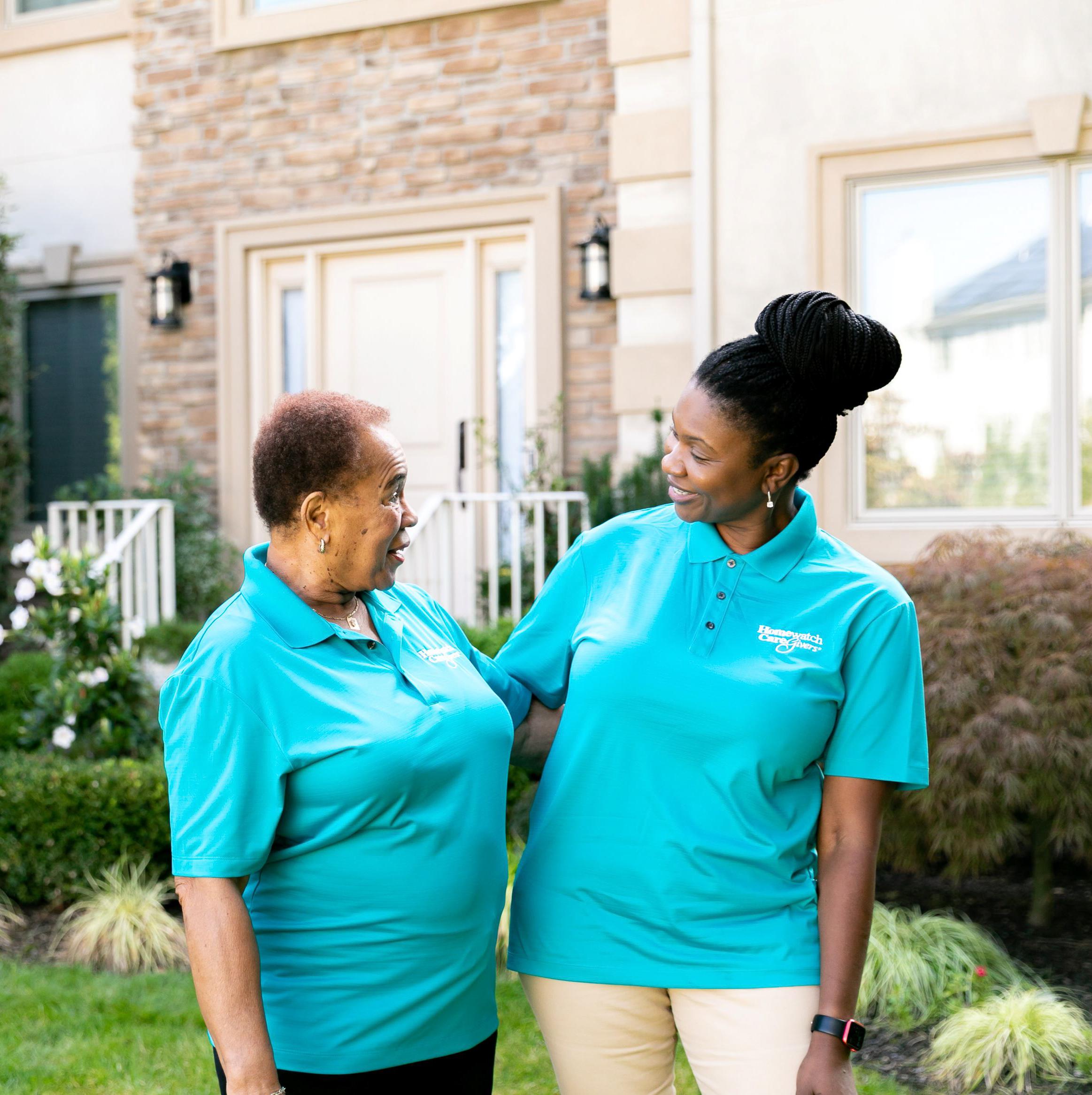Woman at table with female caregiver