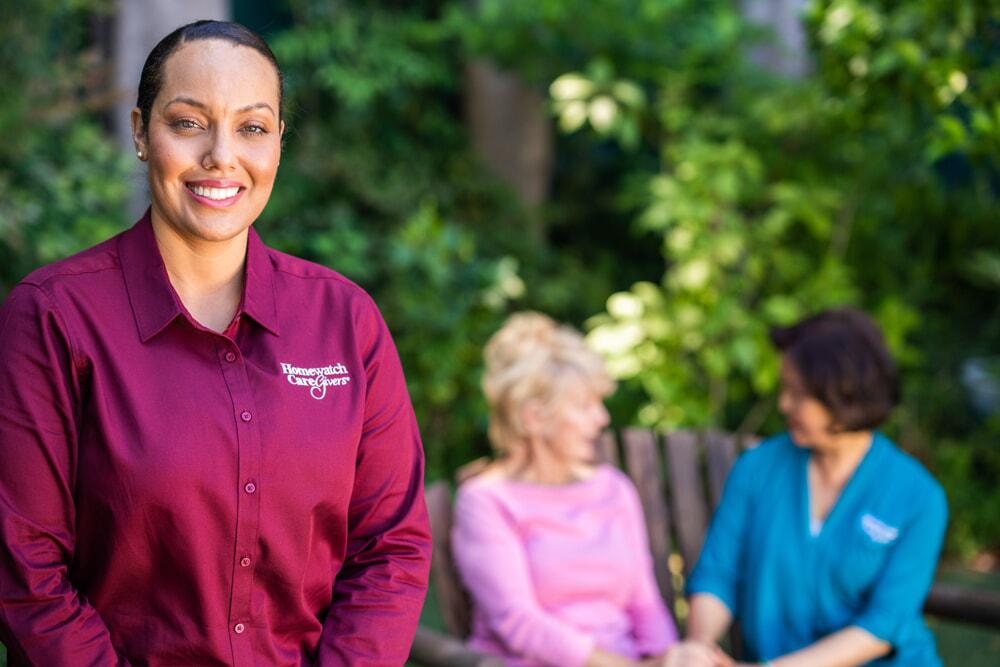 caregivers with older woman