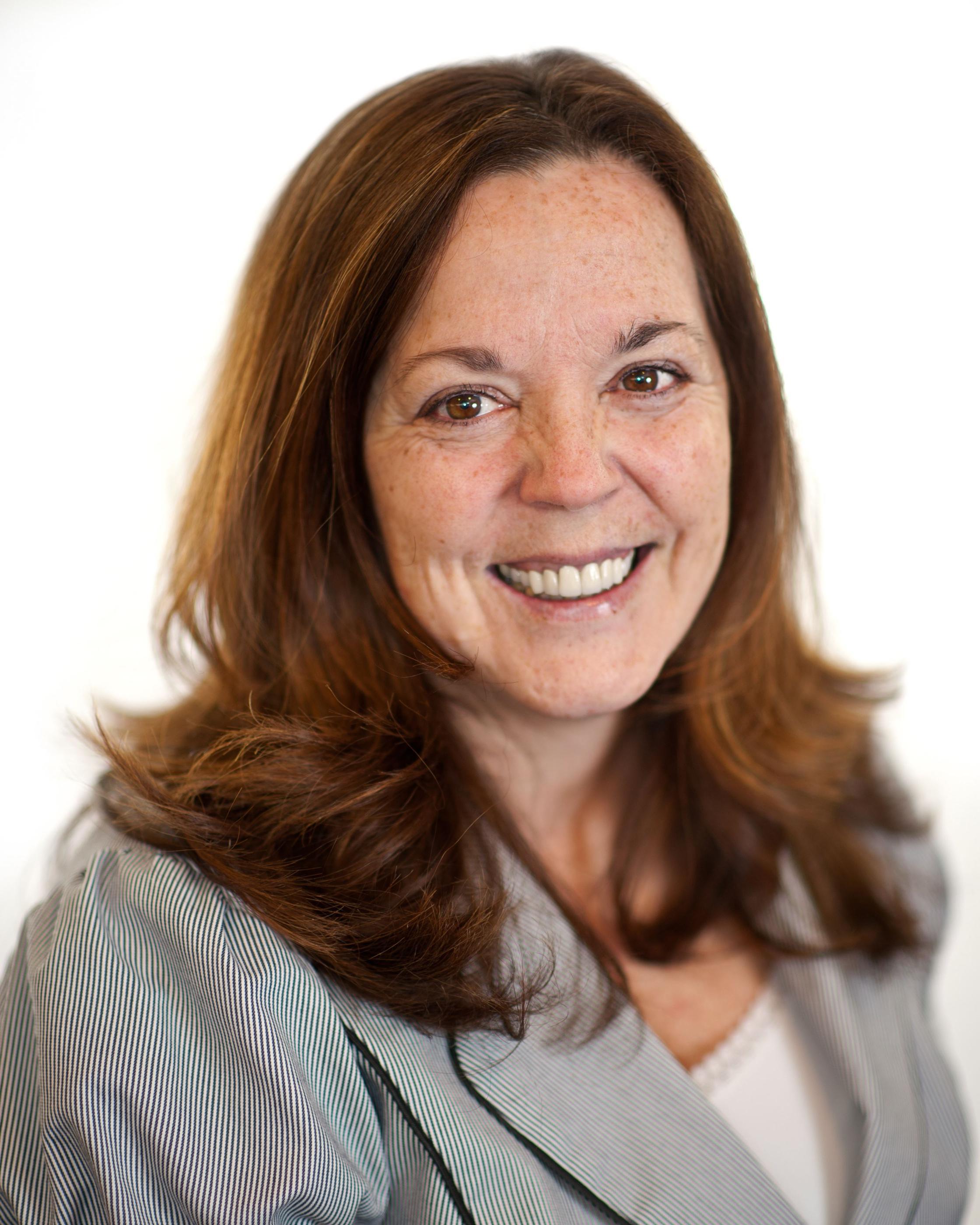 A caregiver walking outside with a patient