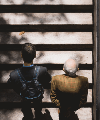 two people walking up stairs