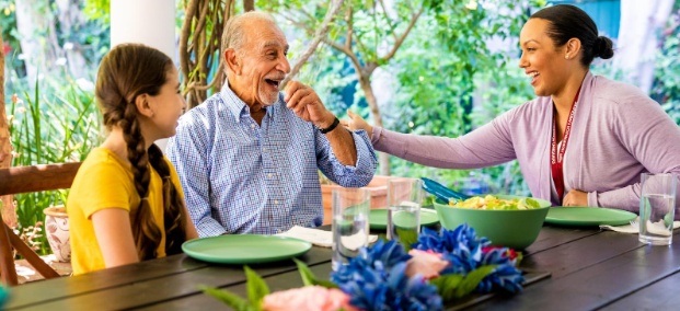 group of people laughing at table