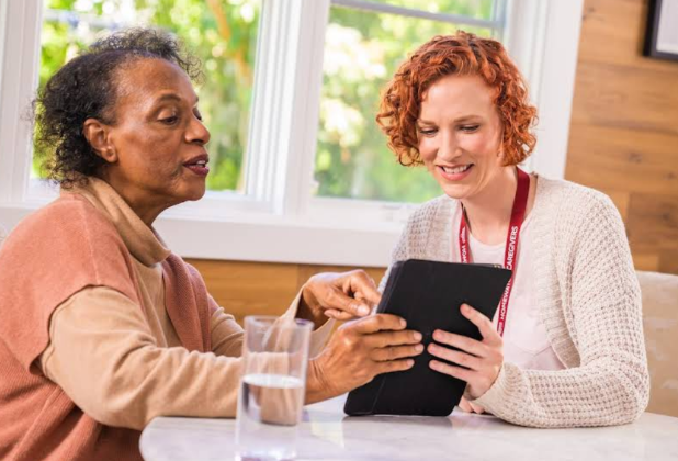 women looking at tablet together