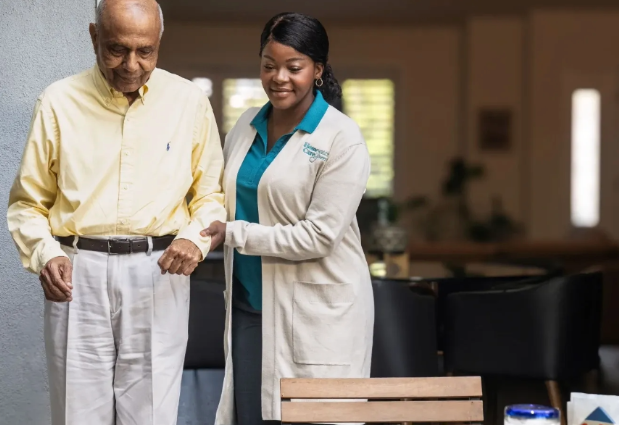 woman holding mans arm and walking with him