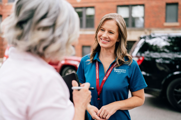 caregiver smiling at woman
