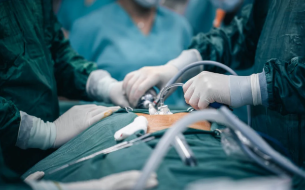 doctors in surgery working on patient