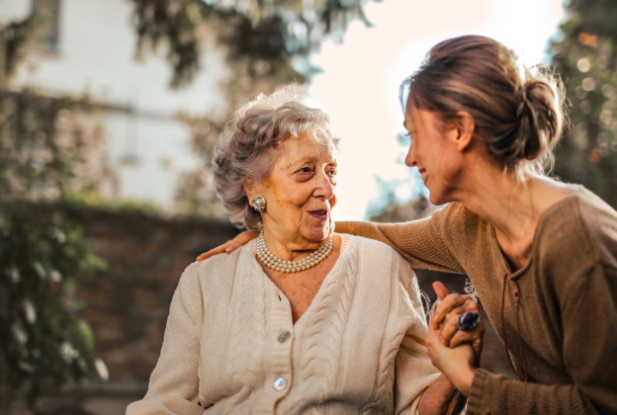 women looking at each other and smiling