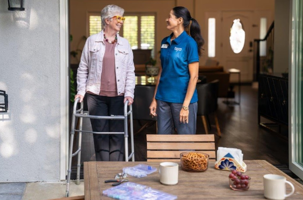 two woman walking outdoors from home