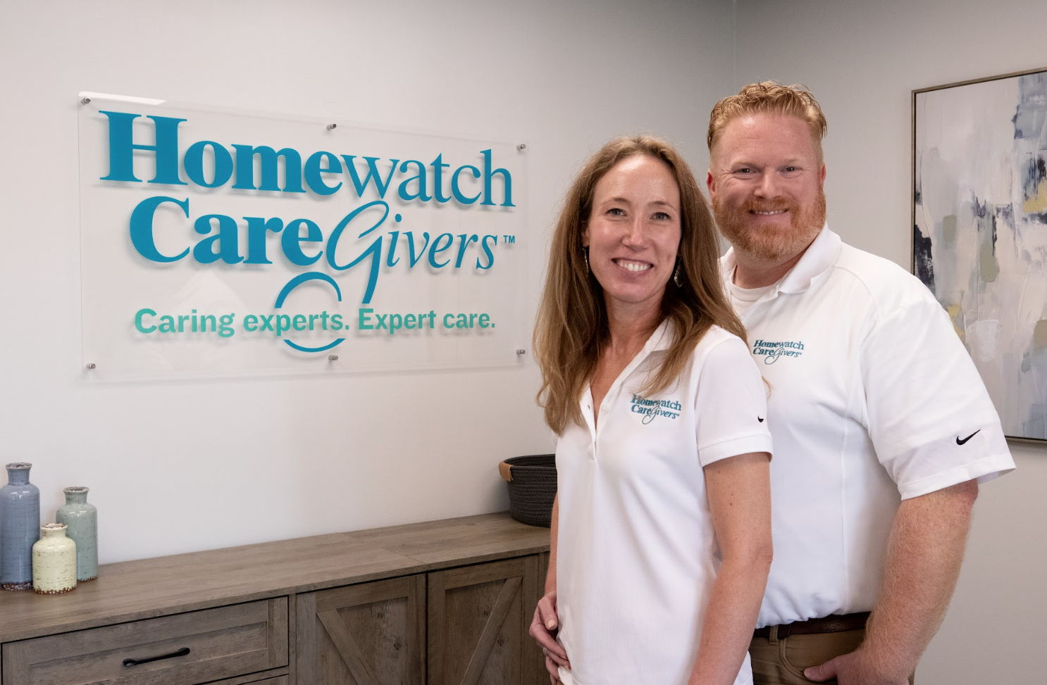 A caregiver walking outside with a patient