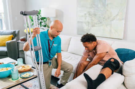 A person with crutches and a person with a crutch