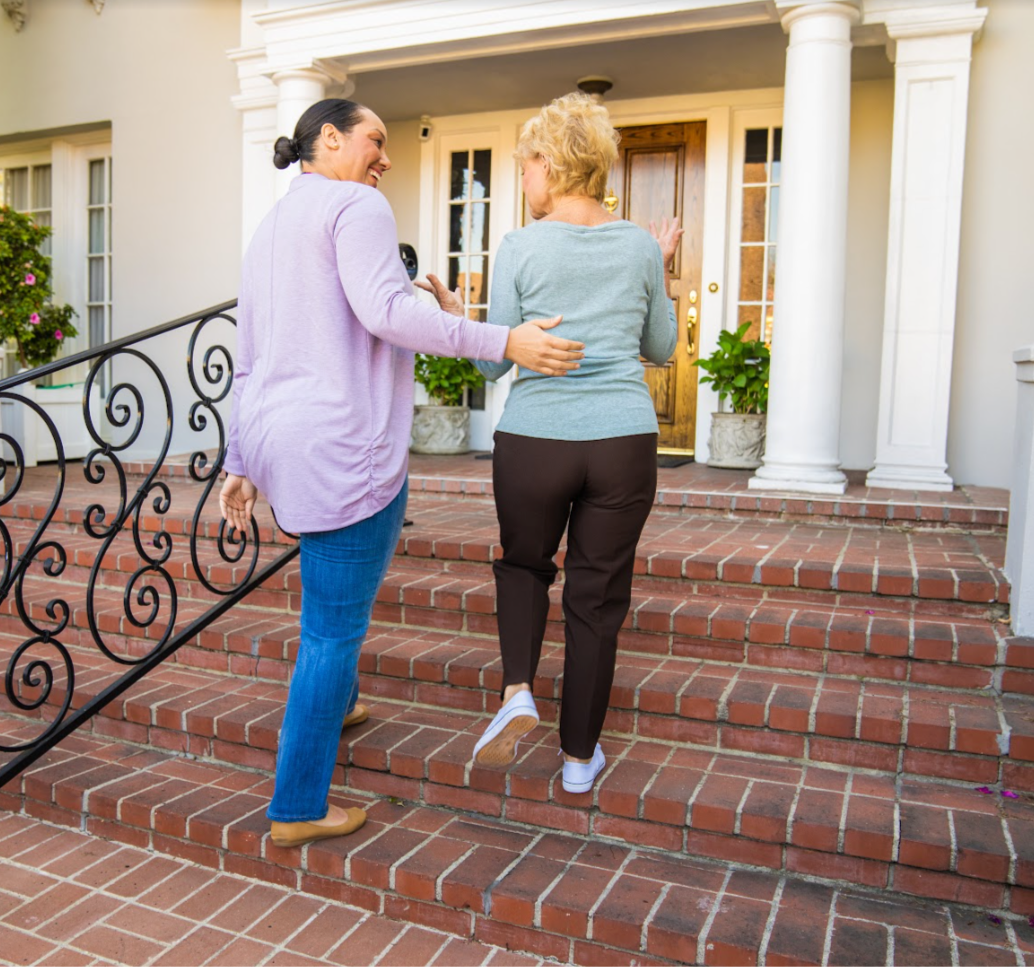 Two women walking up stairs