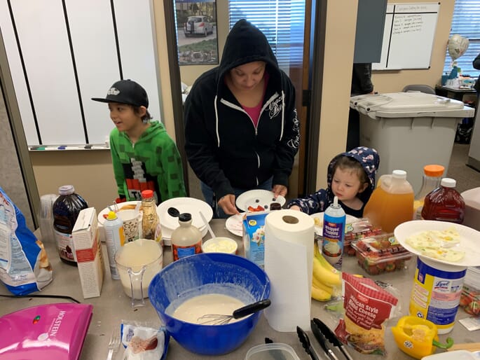 caregiver getting food from table