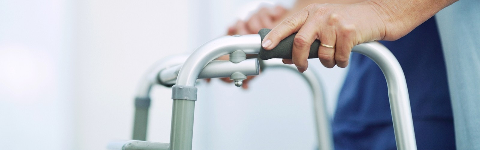 Elderly person using walker