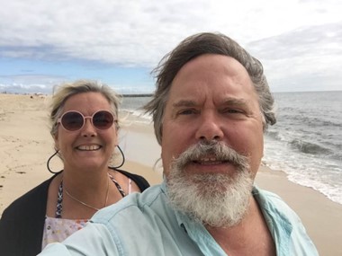 a photo of a man and woman enjoying the beach
